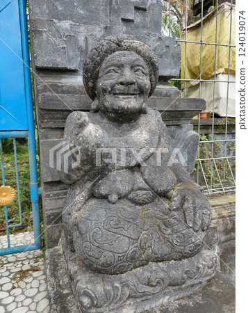 A stone statue that symbolizes the guard of the gate of a house or palace A stone statue that symbolizes the guard of the gate of a house or palace 124019074
