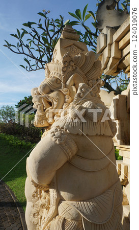 A stone statue that symbolizes the guard of the gate of a house or palace A stone statue that symbolizes the guard of the gate of a house or palace 124019076