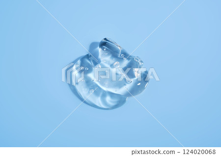 The texture of a cosmetic gel on a blue background. 124020068
