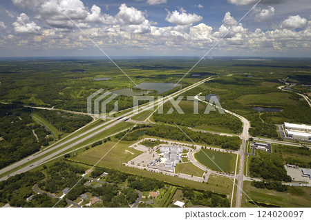 Wide multilane highway crossroads in Florida, USA with fast driving cars. Above view of American transportation infrastructure 124020097