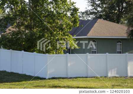White plastic fence for back yard protection and privacy 124020103