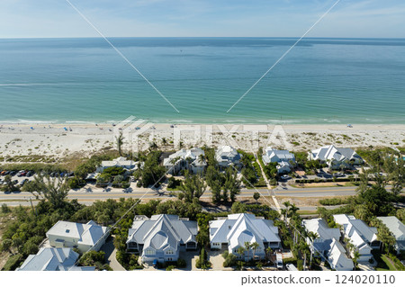 Wealthy waterfront residential area. Rich neighborhood with expensive vacation homes in Boca Grande, small town on Gasparilla Island in southwest Florida Wealthy waterfront residential area. Rich neighborhood with expensive vacation homes in Boca Grande, small town on Gasparilla Island in southwest Florida 124020110