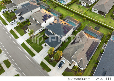 Wealthy residential area in USA suburbs. Rich neighborhood with expensive suburban homes in southwest Florida Wealthy residential area in USA suburbs. Rich neighborhood with expensive suburban homes in southwest Florida 124020111