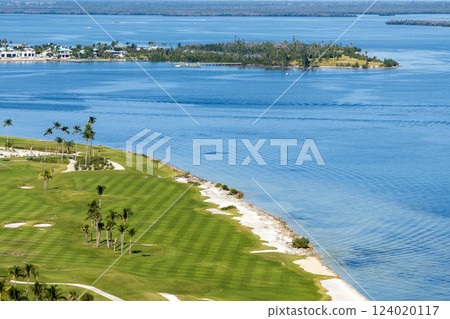 Waterfront golf course in Florida. Sports grounds with green grass in Boca Grande, small town on Gasparilla Island 124020117