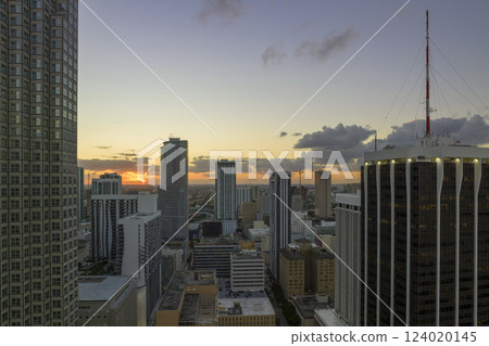 View from above of concrete and glass skyscraper buildings in downtown district of Miami Brickell in Florida, USA at sunset. American megapolis with business financial district at nightfall View from above of concrete and glass skyscraper buildings in downtown district of Miami Brickell in Florida, USA at sunset. American megapolis with business financial district at nightfall 124020145