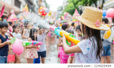 Thai Children celebrating Songkran festival with water fights on street Thai Children celebrating Songkran festival with water fights on street 124020494