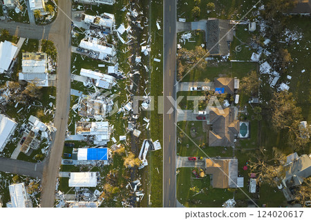Severely damaged by hurricane Ian houses in Florida mobile home residential area. Consequences of natural disaster 124020617