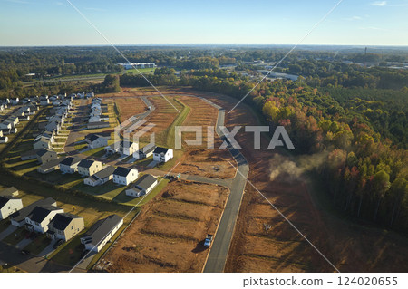 Real estate development with tightly located family houses under construction in South Carolina suburban area. Concept of growing american suburbs 124020655