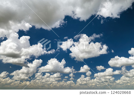 Rain clouds forming on blue Florida sky. Colorful summer skyscape 124020668