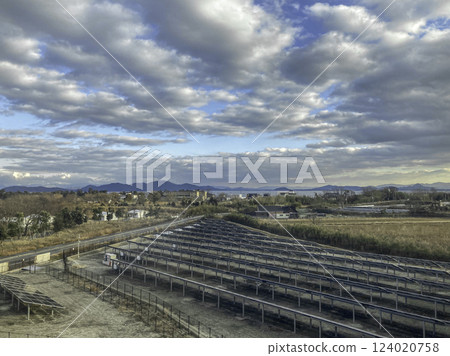 Array of solar panels in countryside, Otsu, Minamikomatsu, near Kyoto, Japan 124020758