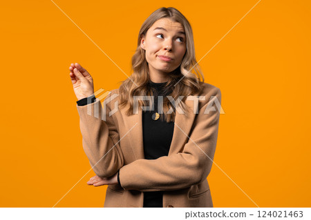 Irritated Sarcastic Businesswoman Showing Bla-Bla Gesture Hands On Yellow Studio Irritated Sarcastic Businesswoman Showing Bla-Bla Gesture Hands On Yellow Studio 124021463