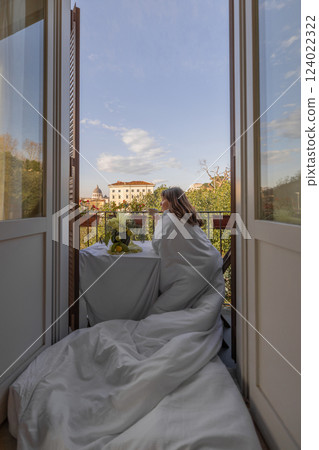 Elegant Morning on a Roman Balcony Elegant Morning on a Roman Balcony 124022322