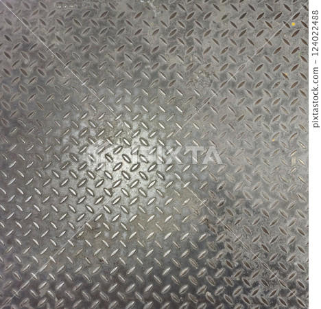 Close-Up View of a Textured Metallic Diamond Plate Surface 124022488