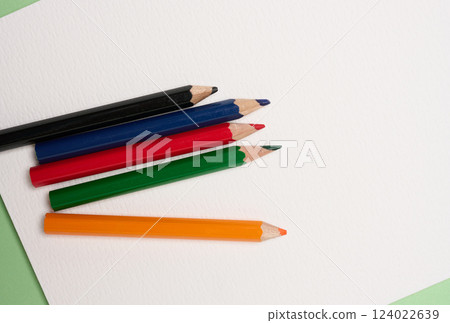 Multicolored wooden pencils on white background, top view 124022639