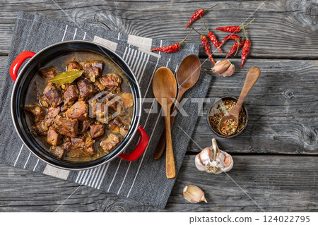 beer braised pork stew in a red pot beer braised pork stew in a red pot 124022795
