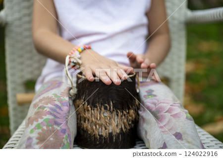 Child playing a hand djembe drum Child playing a hand djembe drum 124022916