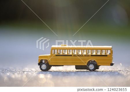 Little model of american yellow school bus outdoor. Concept of education safety in the USA Little model of american yellow school bus outdoor. Concept of education safety in the USA 124023655