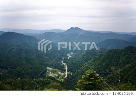 Lush mountains and winding roads 124025196