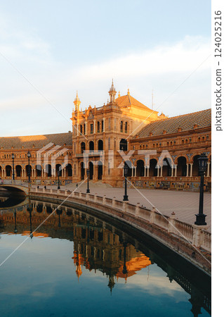 Majestic plaza de Espana at sunset in seville with reflection on canal. Spain Square, Plaza de Majestic plaza de Espana at sunset in seville with reflection on canal. Spain Square, Plaza de 124025216
