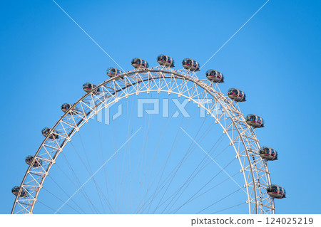 Visitors enjoy panoramic views from the London Eye, a magnificent observation wheel situated on the South Bank of the River Thames. This iconic structure is a must-see landmark in London. Visitors enjoy panoramic views from the London Eye, a magnificent observation wheel situated on the South Bank of the River Thames. This iconic structure is a must-see landmark in London. 124025219