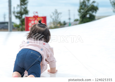 [Infants crawling on giant playground equipment] 124025355