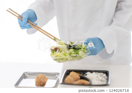 Young woman arranging side dishes, no face Young woman arranging side dishes, no face 124026718