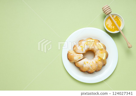 Tasty bake food concept - delicious lemon cake 124027341