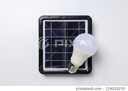 Portable solar panel with white light bulb 124028233