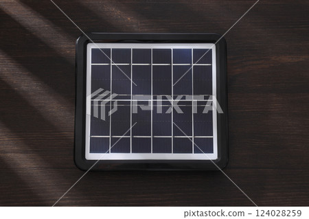 A close-up view of a portable black solar panel A close-up view of a portable black solar panel 124028259