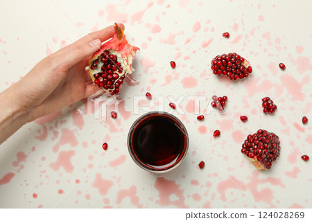 Pomegranate juice, tasty and delicious beverage, fresh drink Pomegranate juice, tasty and delicious beverage, fresh drink 124028269