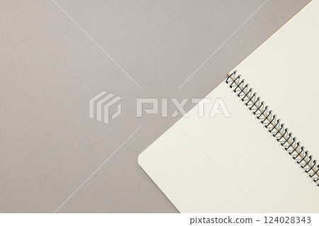 An open notebook lies on a light background An open notebook lies on a light background 124028343