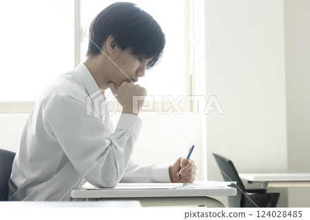 Male students taking classes 124028485