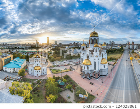 Autumn Yekaterinburg and Temple on Blood in beautiful clear sunset. Aerial view of Yekaterinburg, Russia. Translation of the text on the temple: Honest to the Lord is the death of His saints. Autumn Yekaterinburg and Temple on Blood in beautiful clear sunset. Aerial view of Yekaterinburg, Russia. Translation of the text on the temple: Honest to the Lord is the death of His saints. 124028861