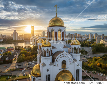 Autumn Yekaterinburg and Temple on Blood in beautiful clear sunset. Aerial view of Yekaterinburg, Russia. Translation of the text on the temple: Honest to the Lord is the death of His saints. 124028876