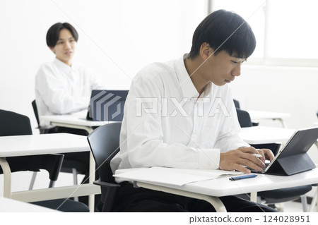 Male students taking classes Male students taking classes 124028951