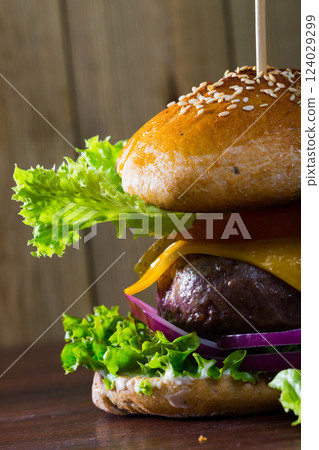 Appetizing burger with big fried meat rissole 124029299