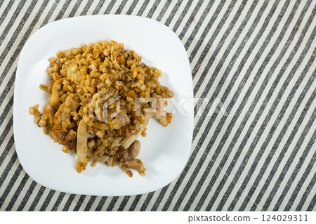 Image of barley porridge with pork roast Image of barley porridge with pork roast 124029311