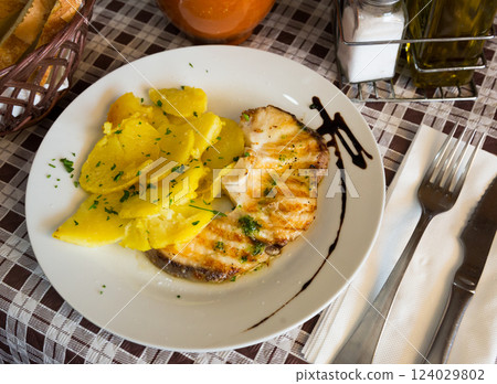 Codfish fillet with green sauce 124029802