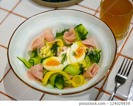Salad with ham, cheese and boiled egg 124029939