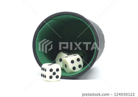 Dice Falling Out of a Cup on White Background Dice Falling Out of a Cup on White Background 124030122