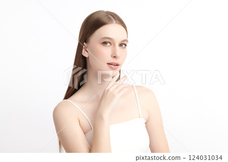 A beautiful young woman with clean, fresh skin against a white background. Skincare, facial treatment, cosmetology, beauty, and spa themes. An elegant portrait of an woman. A beautiful young woman with clean, fresh skin against a white background. Skincare, facial treatment, cosmetology, beauty, and spa themes. An elegant portrait of an woman. 124031034