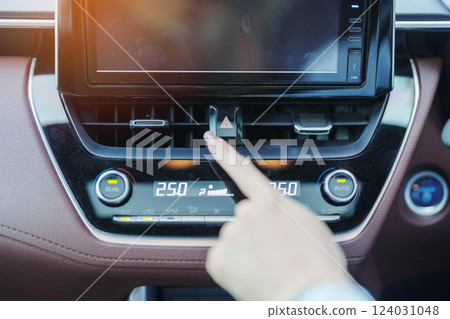 Finger presses the emergency stop button inside the car. Safety and transportation concept 124031048