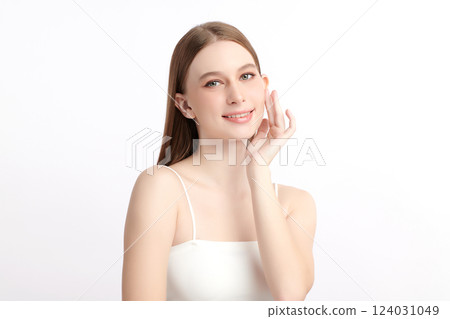 A beautiful young woman with clean, fresh skin against a white background. Skincare, facial treatment, cosmetology, beauty, and spa themes. An elegant portrait of an woman. 124031049