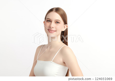 A beautiful young woman with clean, fresh skin against a white background. Skincare, facial treatment, cosmetology, beauty, and spa themes. An elegant portrait of an woman. 124031069