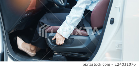 Business woman hand adjust car seat before drive on the road. Ergonomic, health  care and safety transportation concept 124031070