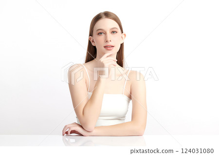 A beautiful young woman with clean, fresh skin against a white background. Skincare, facial treatment, cosmetology, beauty, and spa themes. An elegant portrait of an woman. A beautiful young woman with clean, fresh skin against a white background. Skincare, facial treatment, cosmetology, beauty, and spa themes. An elegant portrait of an woman. 124031080