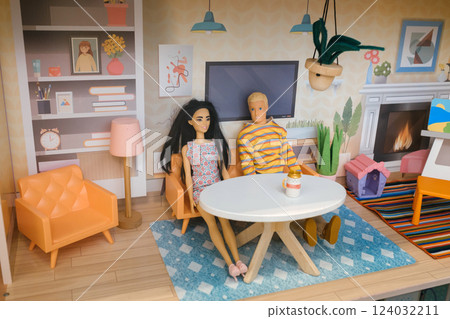 Couple enjoys a cozy afternoon in a stylish dollhouse living room decorated with modern furniture and bright colors 124032211