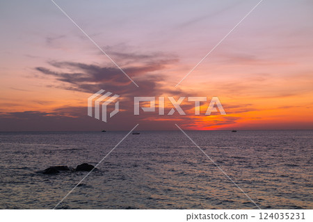 Beautiful Pink Clouds Sunset from the Sea Beautiful Pink Clouds Sunset from the Sea 124035231