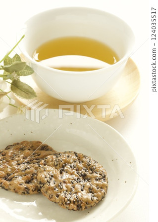 Sesame crackers and green tea Sesame crackers and green tea 124035517