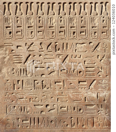 Ancient Egyptian hieroglyphs on stone wall, Karnak Temple Complex, Luxor, Egypt, Africa. Stone carvings with hieroglyphs at Karnak temple, Luxor, Thebes 124036010